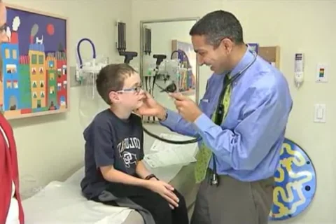 Dr. Butte examines young patient.