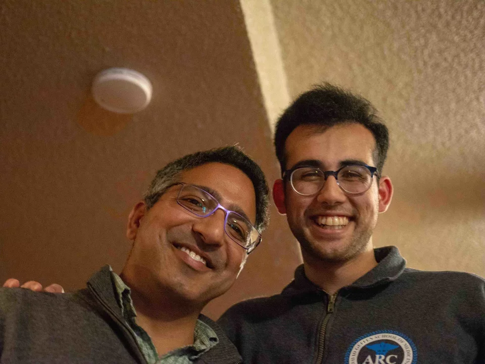 Lab members Manish Butte and Humza standing, smiling down at camera in March 2019.