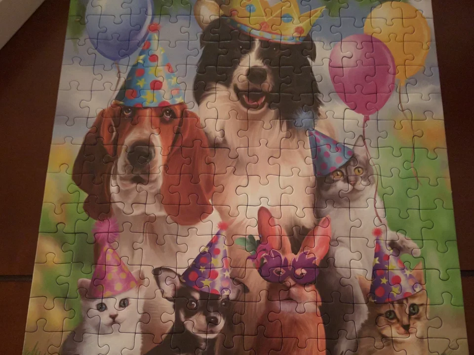 Birthday party puzzle showing cats and dogs. From Butte & Bolliky Labs in Crystal Bay, Nevada, March 12, 2016.