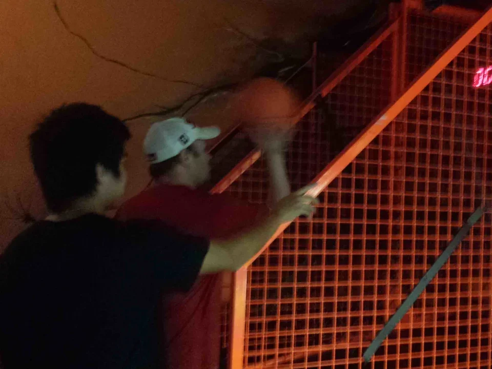 Two men walk up set of stairs for laser quest on Oct 21, 2014.